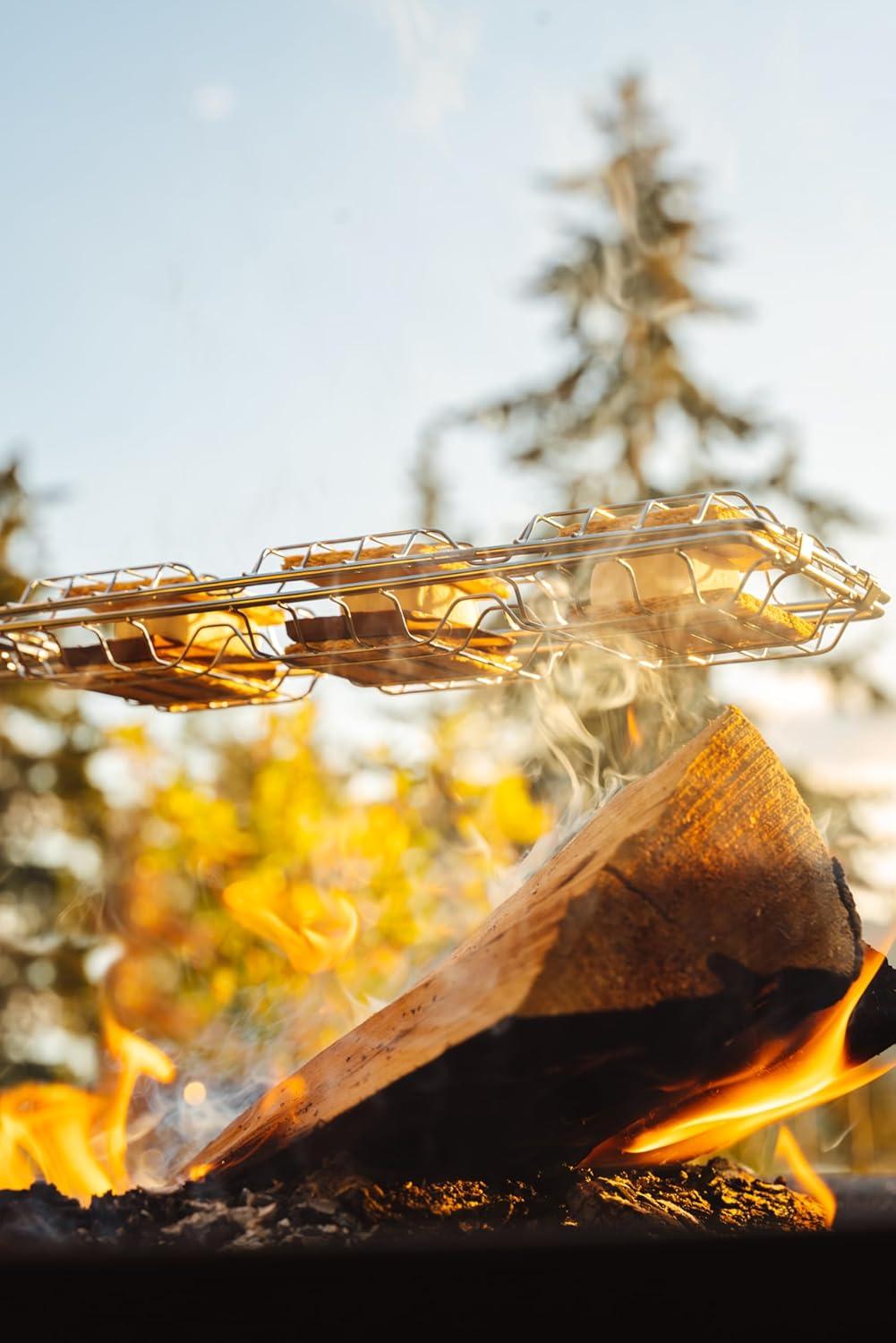 imageCoghlans Campers SMores Grill ChromePlated Steel Portable and Compact Outdoor Cooking Tool for Making 3 SMores at Once 17Inch Handle with Sliding Lock Ring for Secure Campfire
